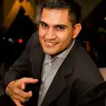 Amir Khan, Founder and incorporations specialist at Infinite Corporate, smiling in a suit
